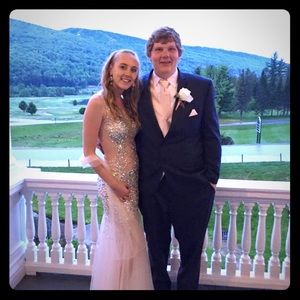 Sheer, hand beaded, nude color prom gown.